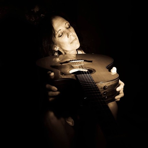 Black and White picture of Katrina with her guitar